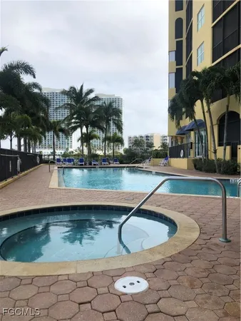 a view of a swimming pool with a yard