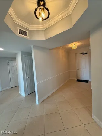 a view of a livingroom with furniture and a fan
