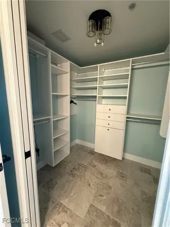 a view of an empty walk in closet