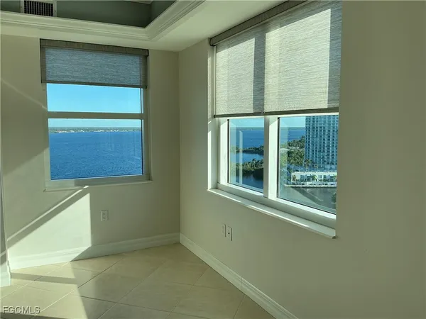 a view of an empty room with a window