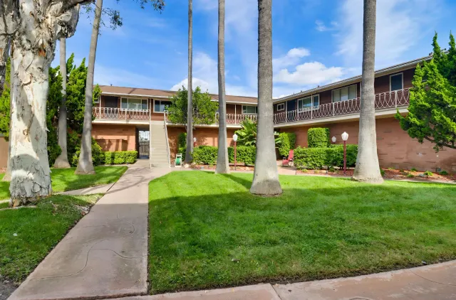 a view of a building with a yard