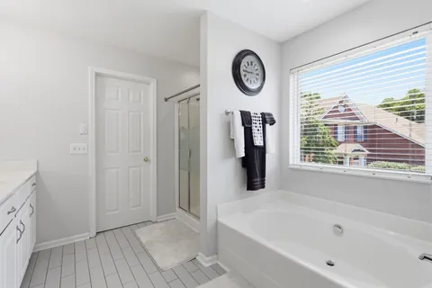 a house view with a sitting space and garden