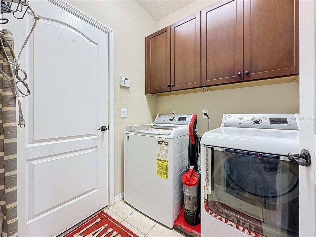 255 Silver Maple Road Groveland, FL 34736 - Photo 40 of 68 a utility room with dryer and washer