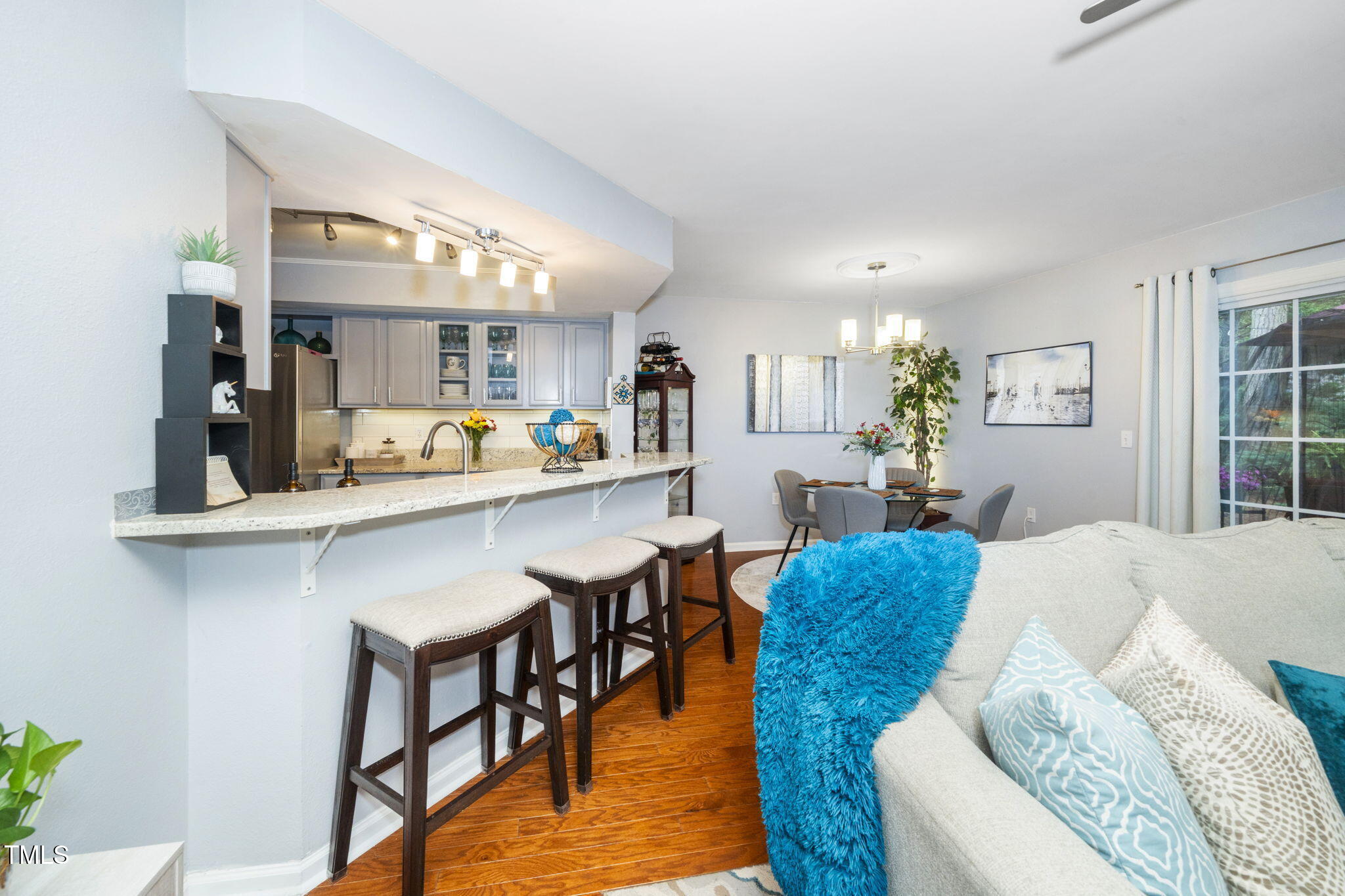 7704 Falcon Rest Circle Raleigh, NC 27615 - Photo 14 of 23 a living room with furniture and kitchen view