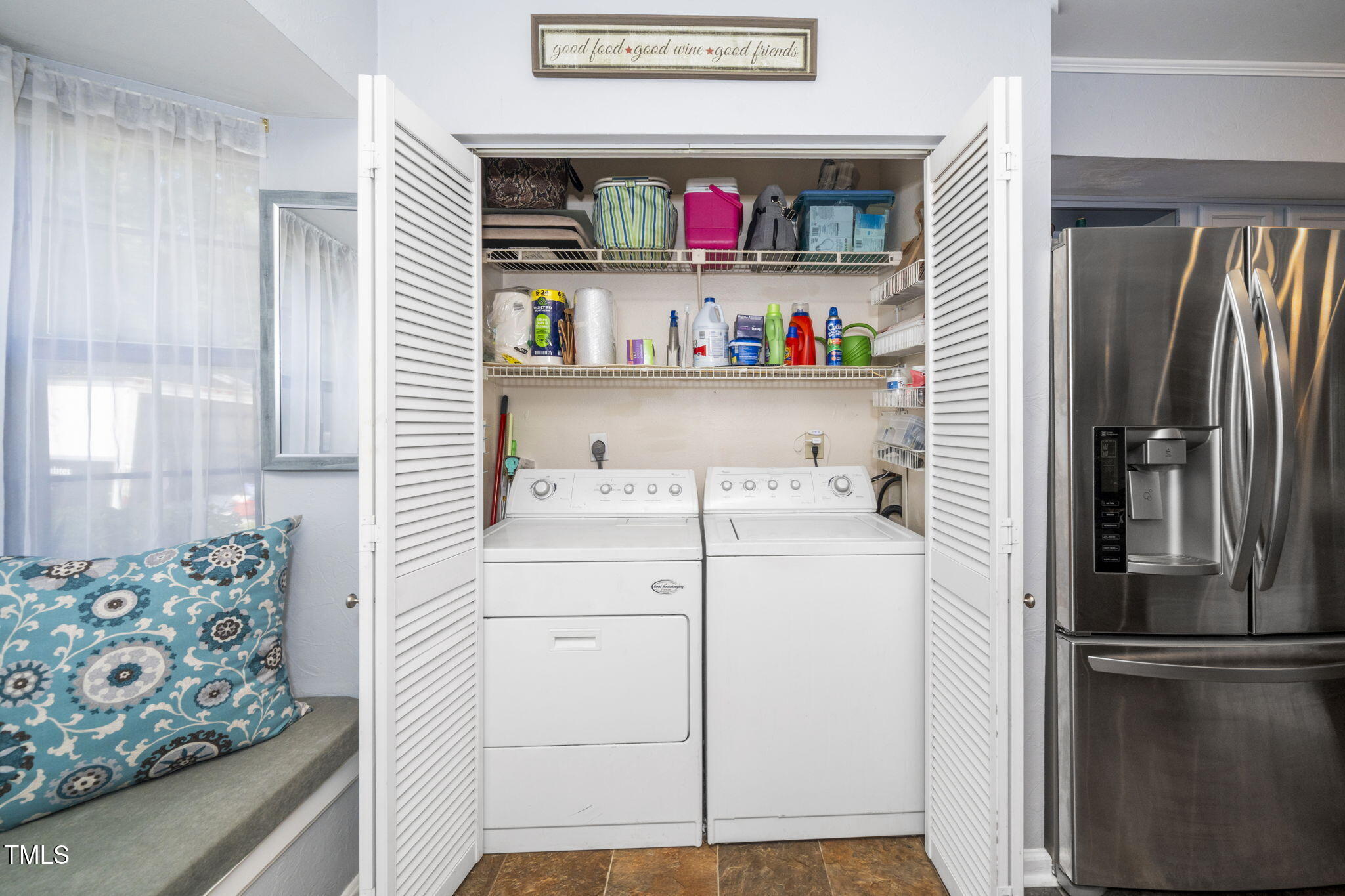 7704 Falcon Rest Circle Raleigh, NC 27615 - Photo 15 of 23 a kitchen with stainless steel appliances a refrigerator and a window