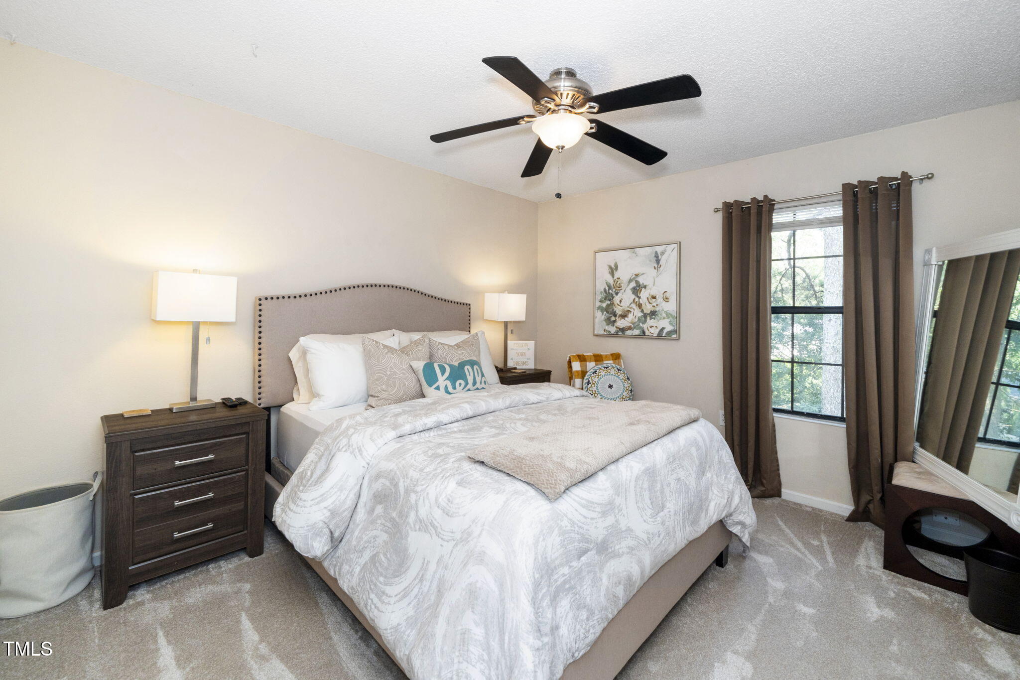 7704 Falcon Rest Circle Raleigh, NC 27615 - Photo 20 of 23 a large bed sitting in a bedroom next to a window