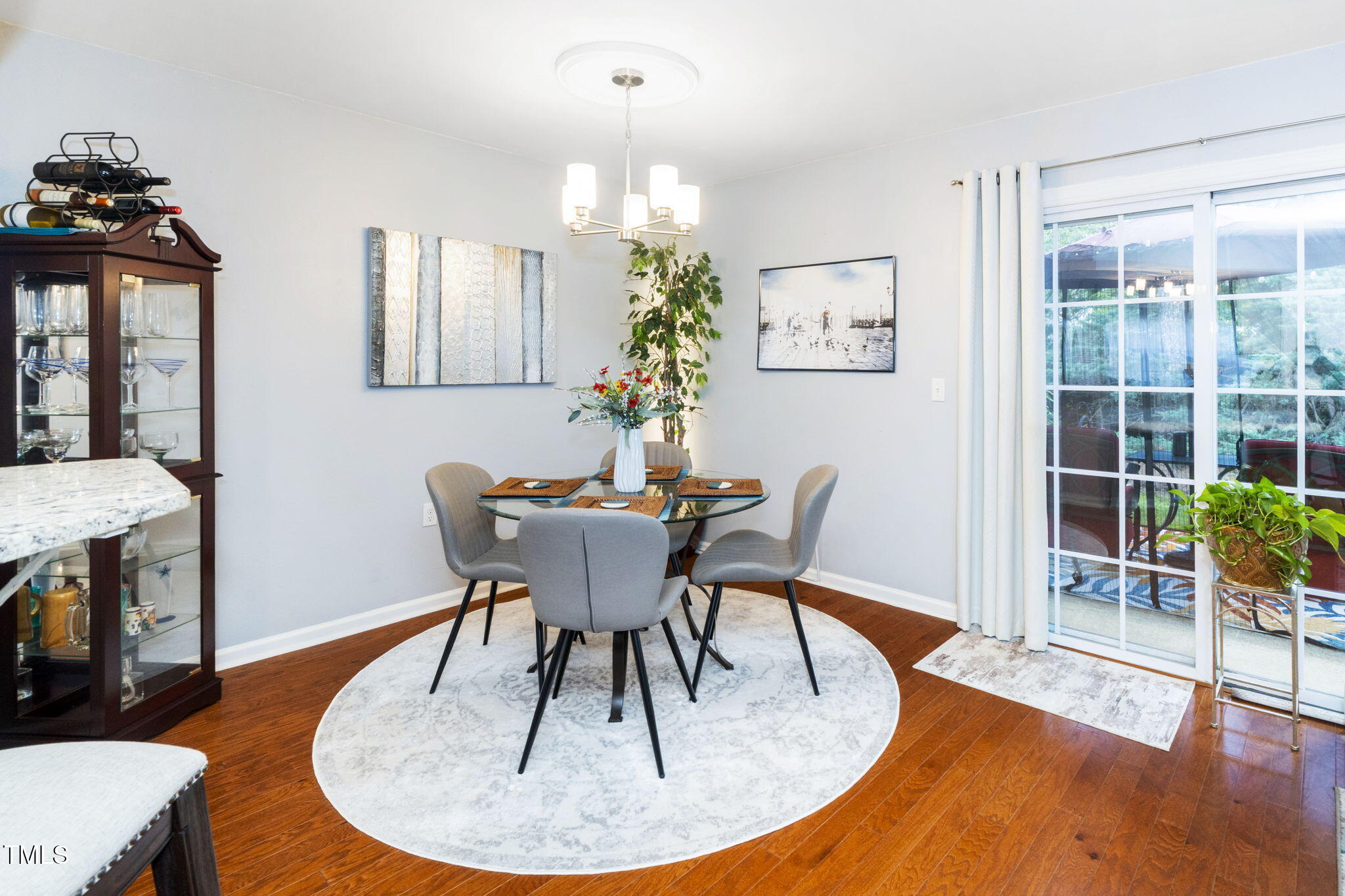 7704 Falcon Rest Circle Raleigh, NC 27615 - Photo 9 of 23 a view of a dining room with furniture window and wooden floor