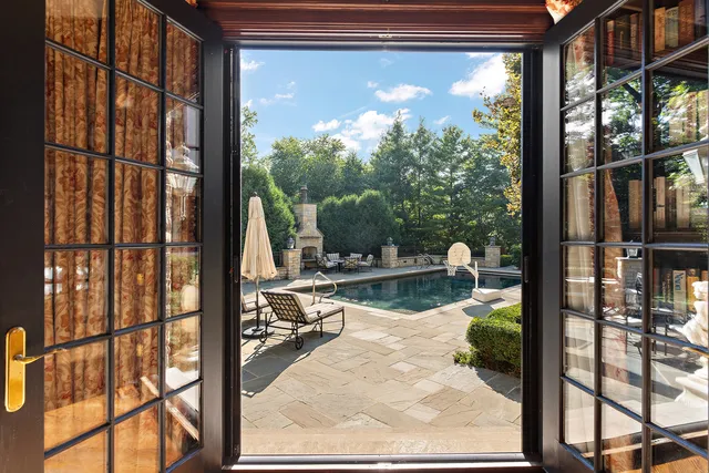 a view of a living room and floor to ceiling window or lake