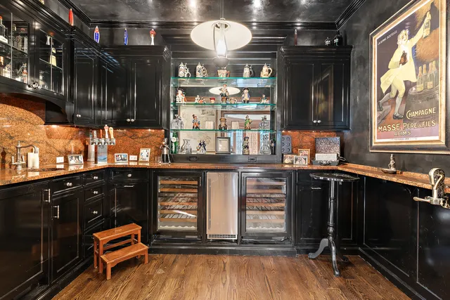 a kitchen with granite countertop a sink and cabinets