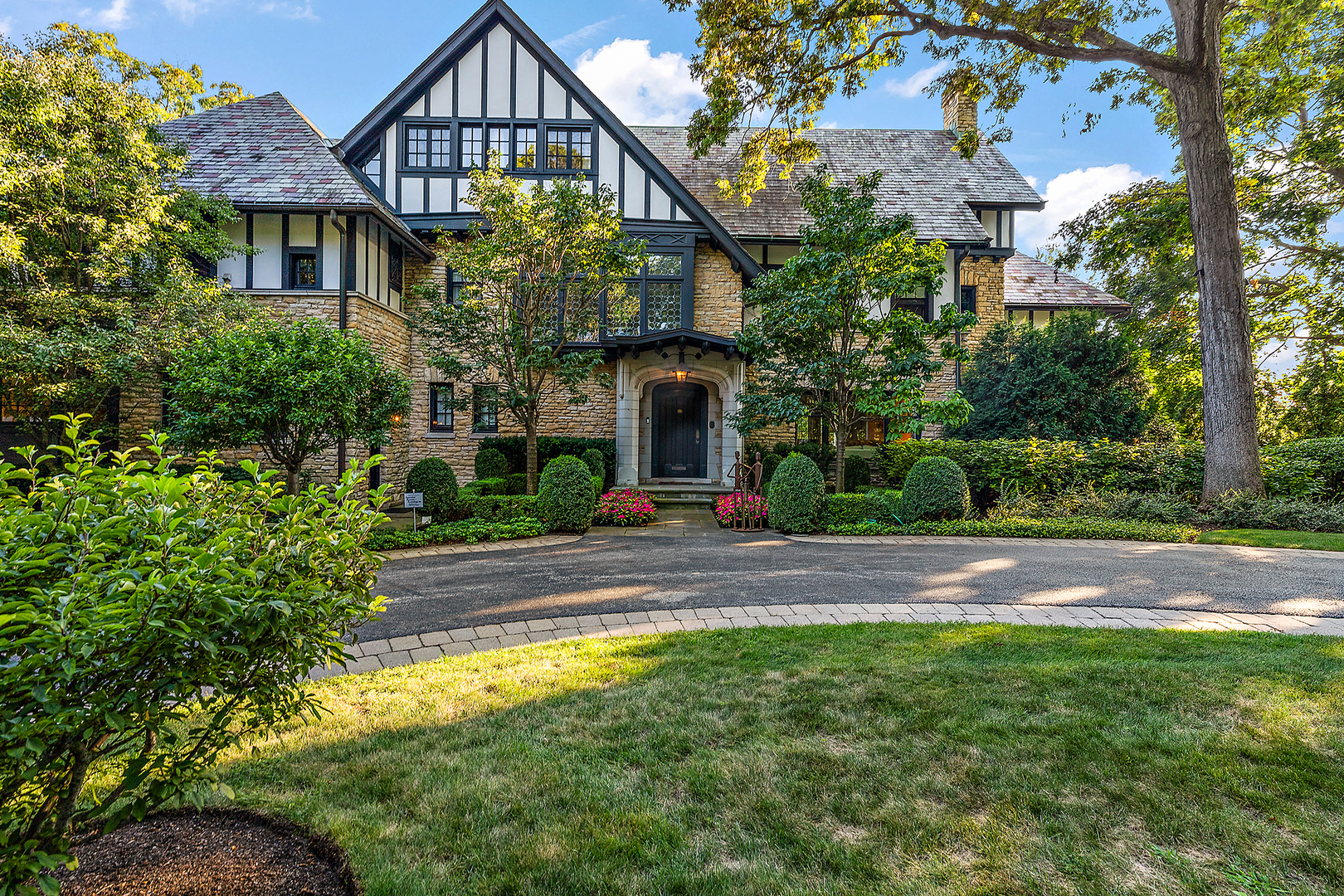 640 Hill Road Winnetka, IL 60093 - Photo 2 of 52 a front view of house with yard and green space