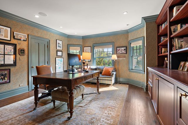 a view of a livingroom with furniture window and wooden floor