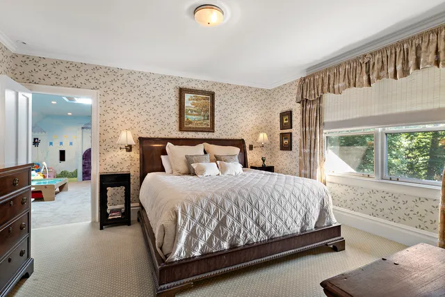 a bedroom with a bed and window