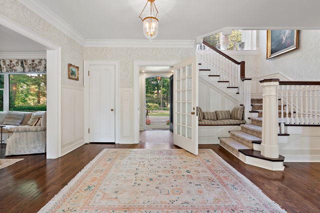 a view of a livingroom with furniture and a window