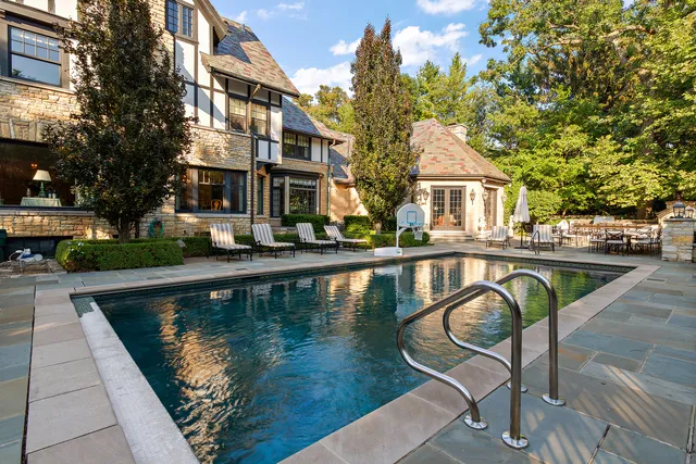 a view of swimming pool with outdoor seating yard and barbeque oven