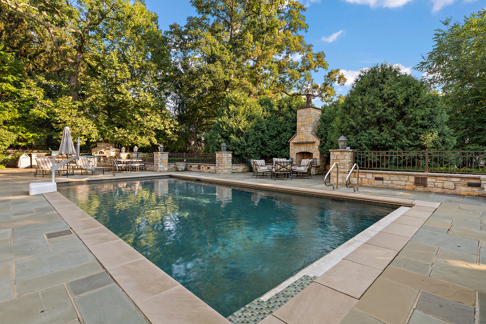 640 Hill Road Winnetka, IL 60093 - Photo 43 of 52 a view of a swimming pool with a patio