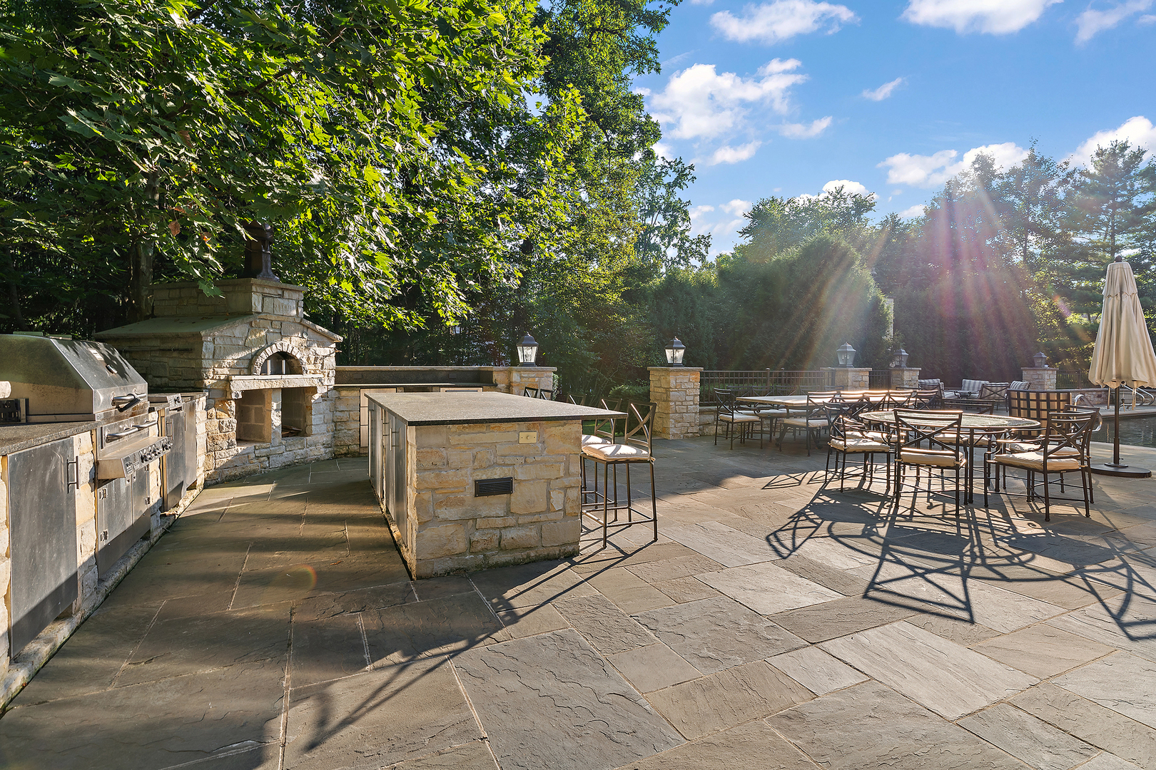 640 Hill Road Winnetka, IL 60093 - Photo 46 of 52 a view of a patio with table and chairs with wooden floor and fence