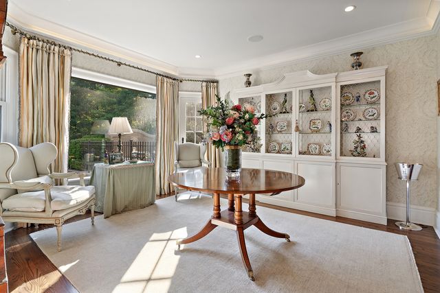 a view of a livingroom with furniture and a window