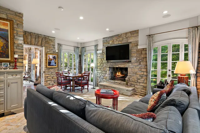 a living room with furniture fireplace and a flat screen tv