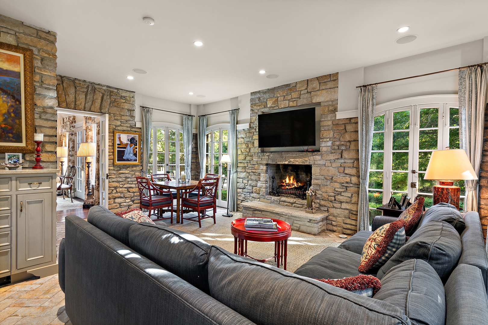 640 Hill Road Winnetka, IL 60093 - Photo 9 of 52 a living room with furniture fireplace and a flat screen tv