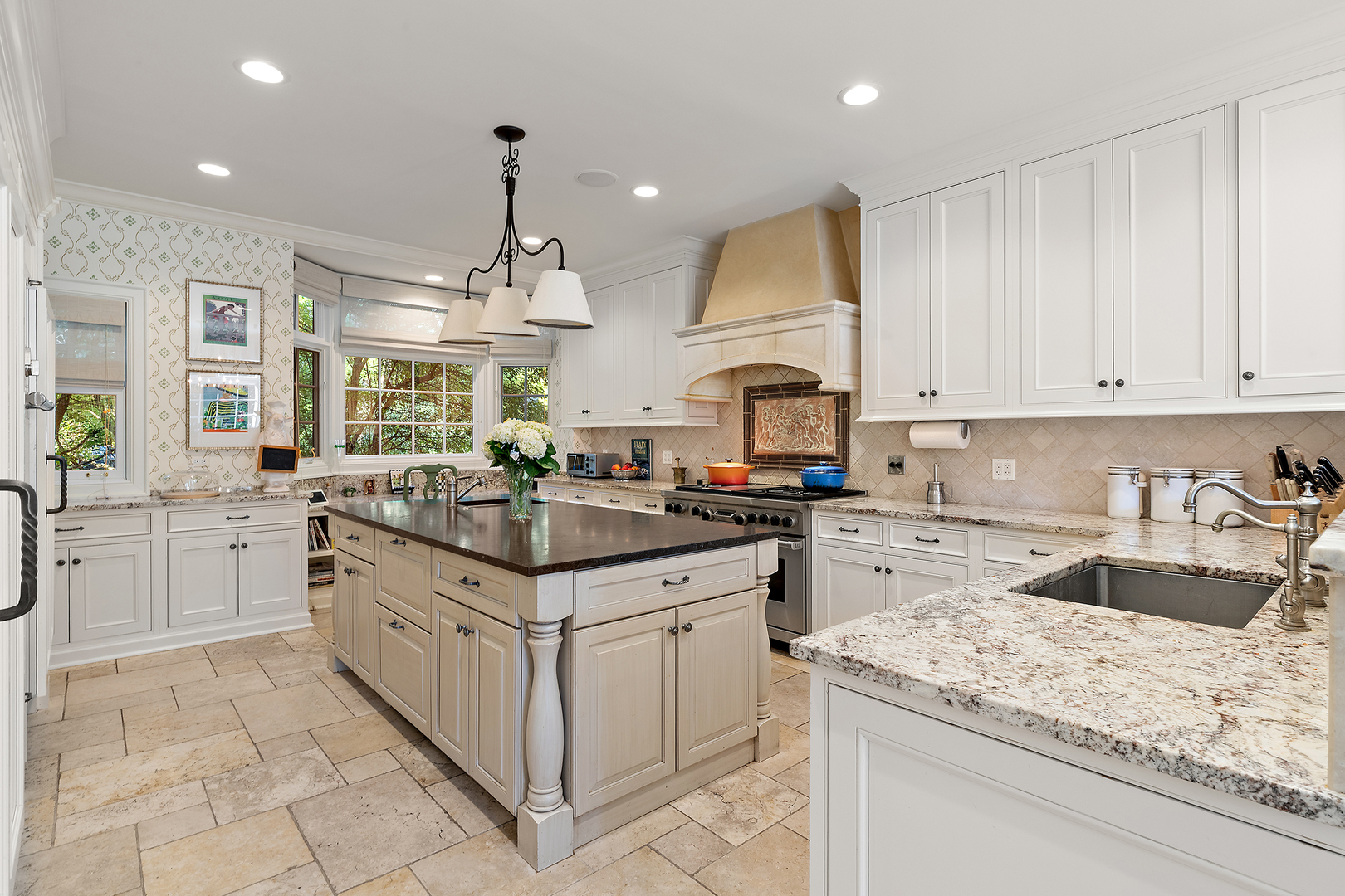 640 Hill Road Winnetka, IL 60093 - Photo 10 of 52 a kitchen with granite countertop a sink stove and cabinets
