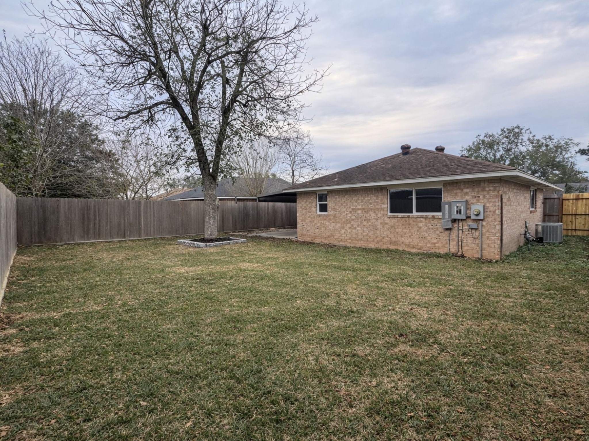 1318 Epsilon Street Pasadena, TX 77504 - Photo 14 of 15 a view of a house with a yard