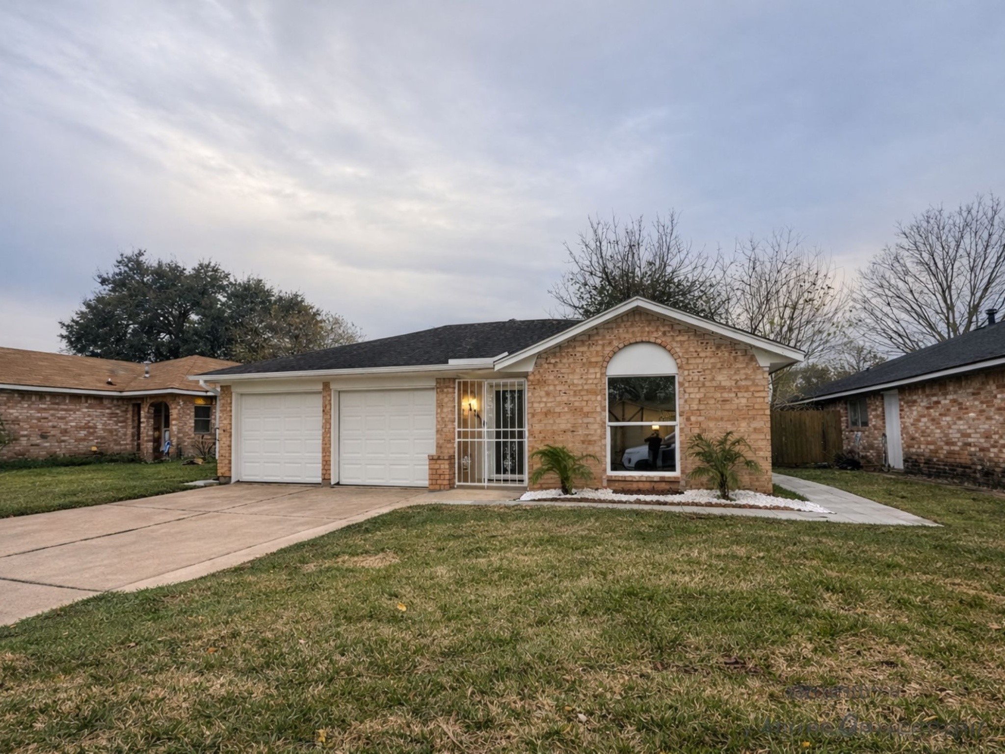 1318 Epsilon Street Pasadena, TX 77504 - Photo 15 of 15 a house with huge green field in front of it
