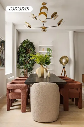a living room with furniture and potted plant
