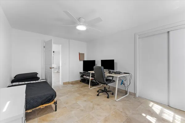 a workspace with furniture and a window