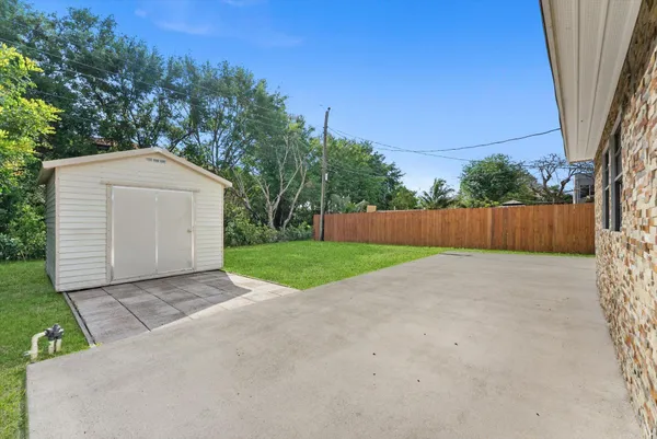a view of backyard with green space