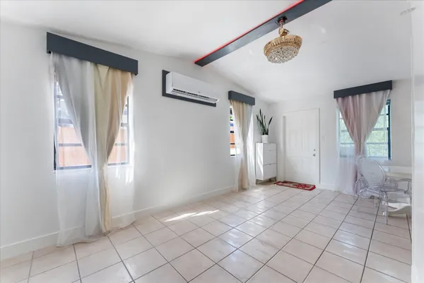 a view of an empty room and window