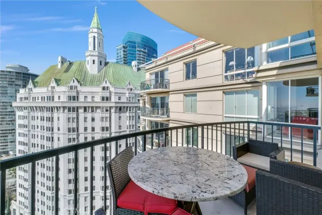 a bathroom with a glass shower door and sink
