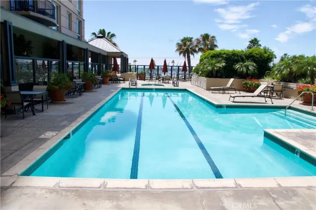 a bathroom with a shower and a glass door