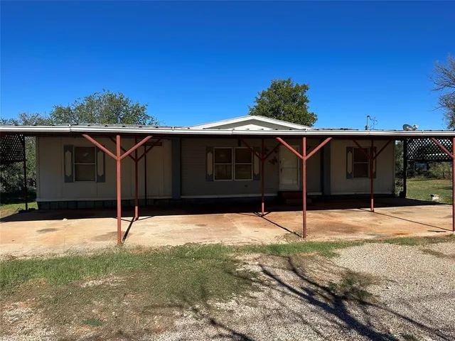 a house with trees in the background