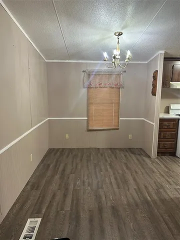 a view of an empty room with a fireplace