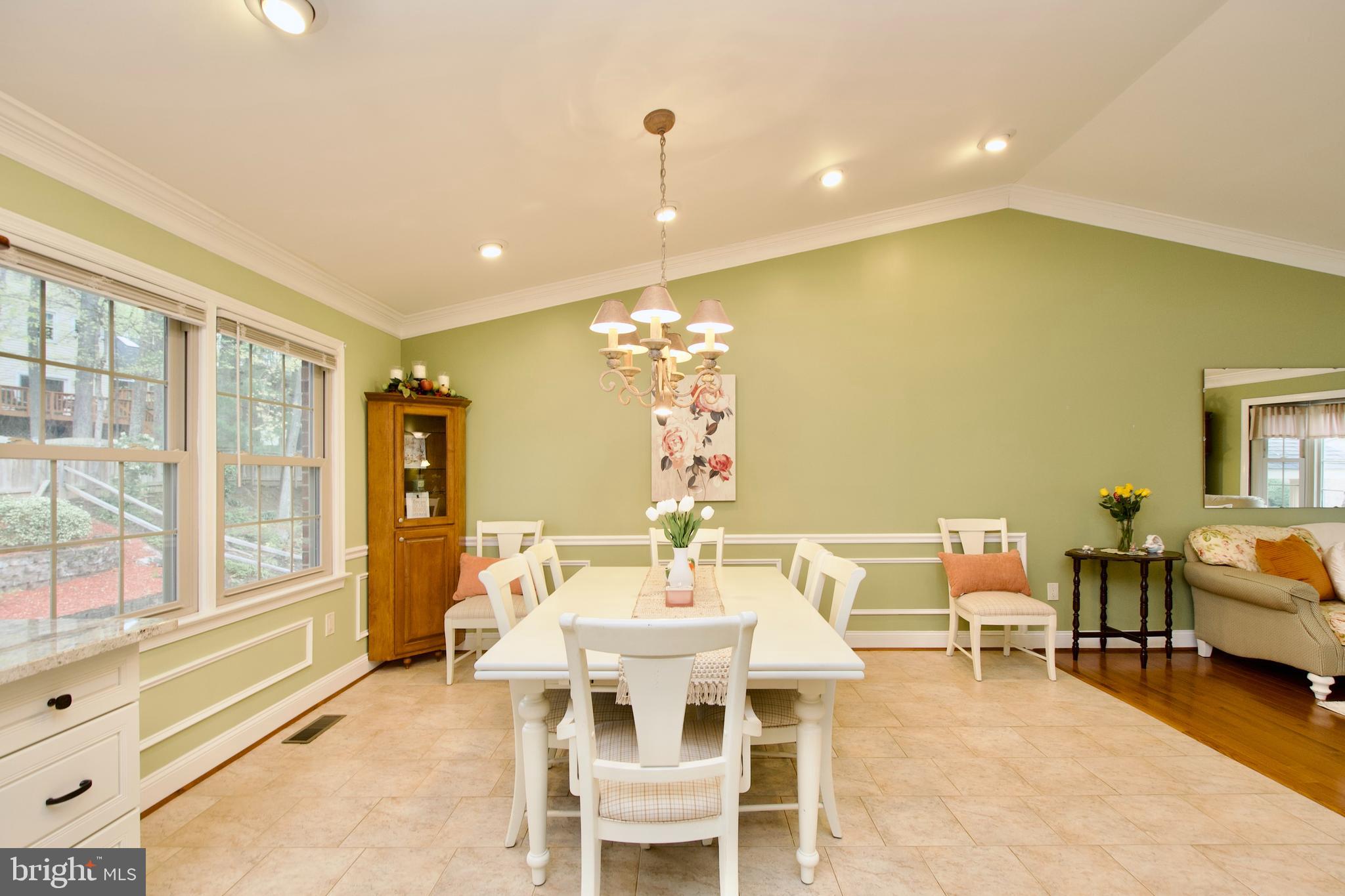 6690 Old Blacksmith Drive Burke, VA 22015 - Photo 11 of 46 a view of a dining room with furniture window and outside view