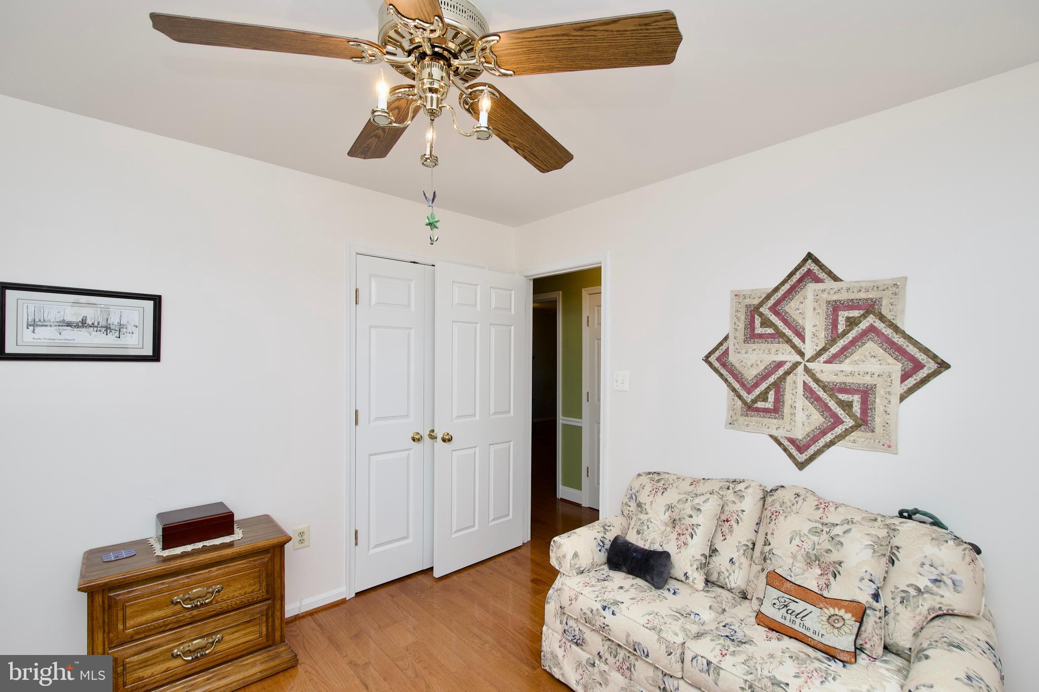 6690 Old Blacksmith Drive Burke, VA 22015 - Photo 21 of 46 a bedroom with furniture and wooden floor