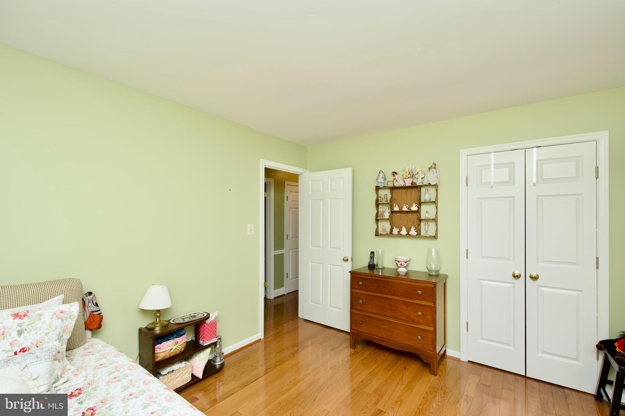 6690 Old Blacksmith Drive Burke, VA 22015 - Photo 23 of 46 a room with toys and wooden floor