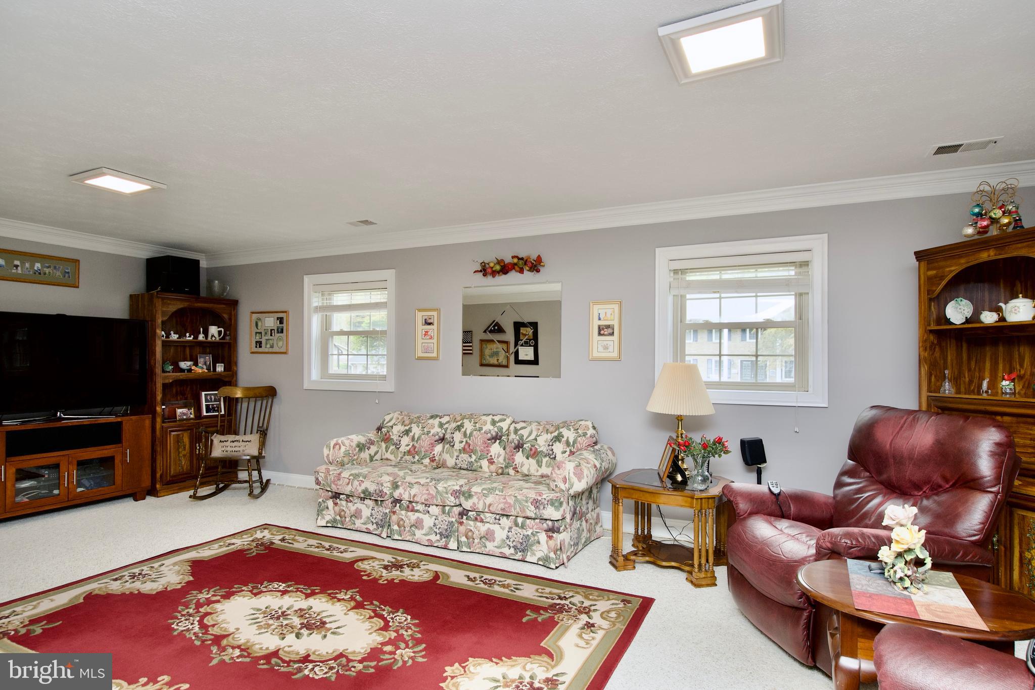 6690 Old Blacksmith Drive Burke, VA 22015 - Photo 33 of 46 a living room with furniture and a flat screen tv