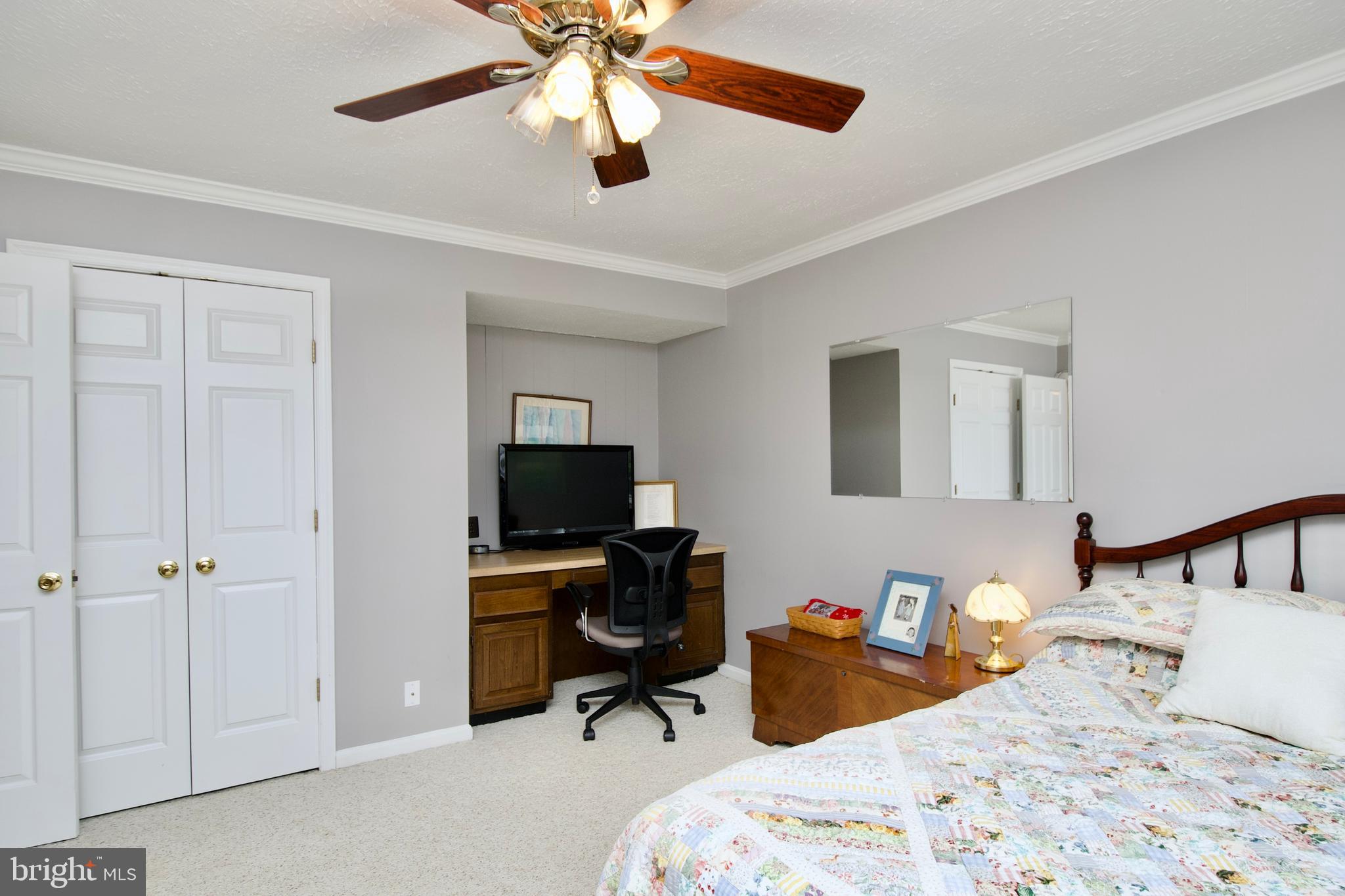 6690 Old Blacksmith Drive Burke, VA 22015 - Photo 40 of 46 a bedroom with bed and a chandelier
