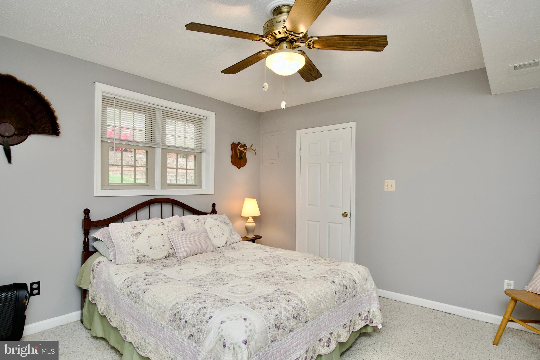 6690 Old Blacksmith Drive Burke, VA 22015 - Photo 42 of 46 a bedroom with a bed and a window