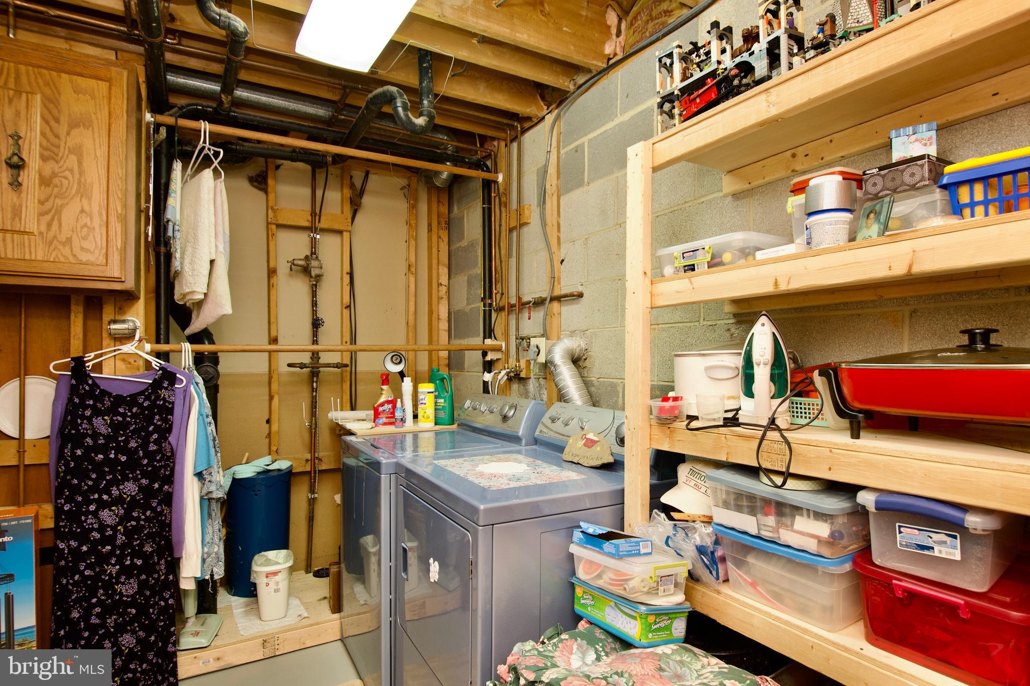 6690 Old Blacksmith Drive Burke, VA 22015 - Photo 44 of 46 a view of walk in closet with clothes and shoes