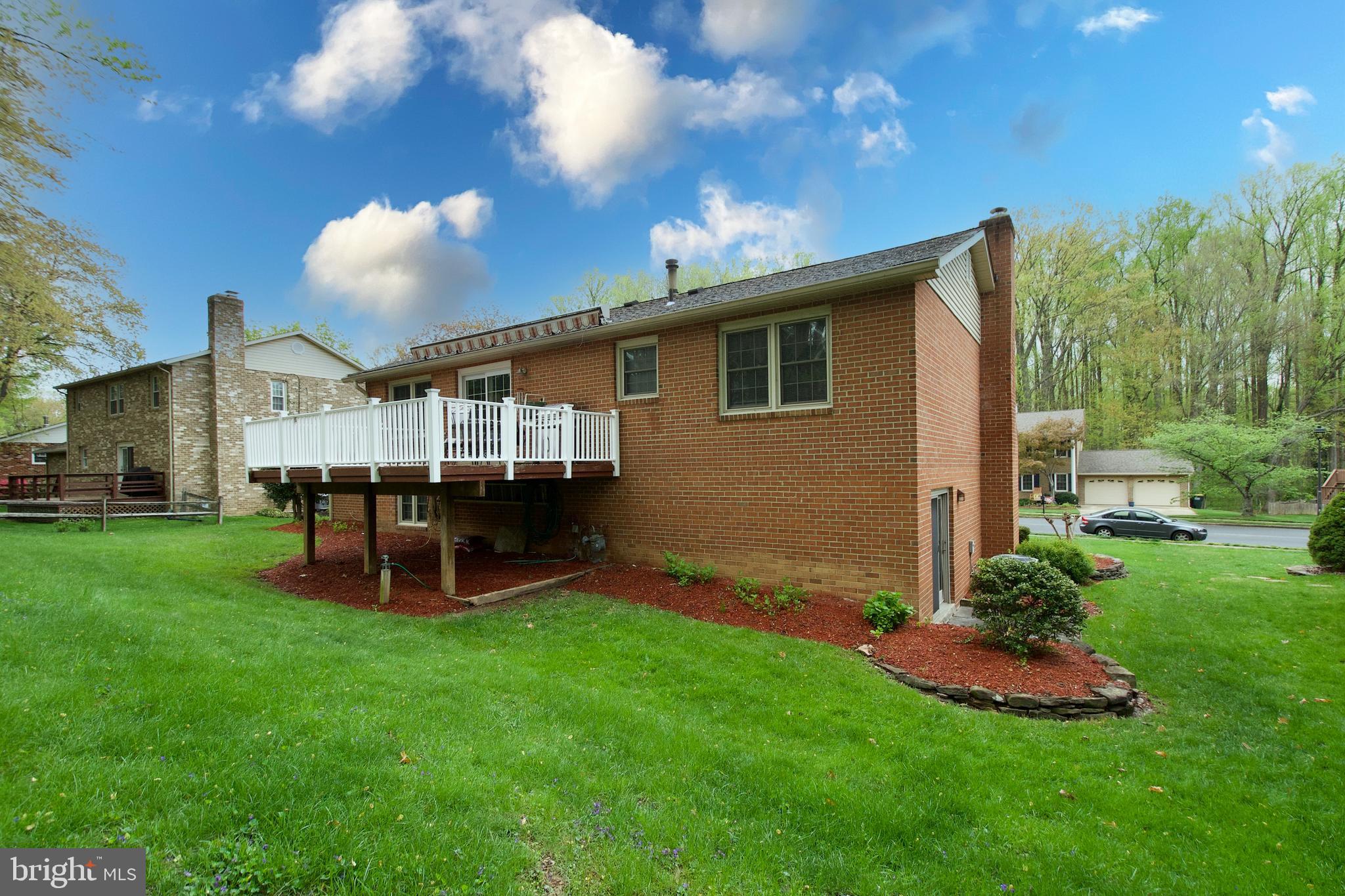 6690 Old Blacksmith Drive Burke, VA 22015 - Photo 46 of 46 a view of a house with a backyard and a patio