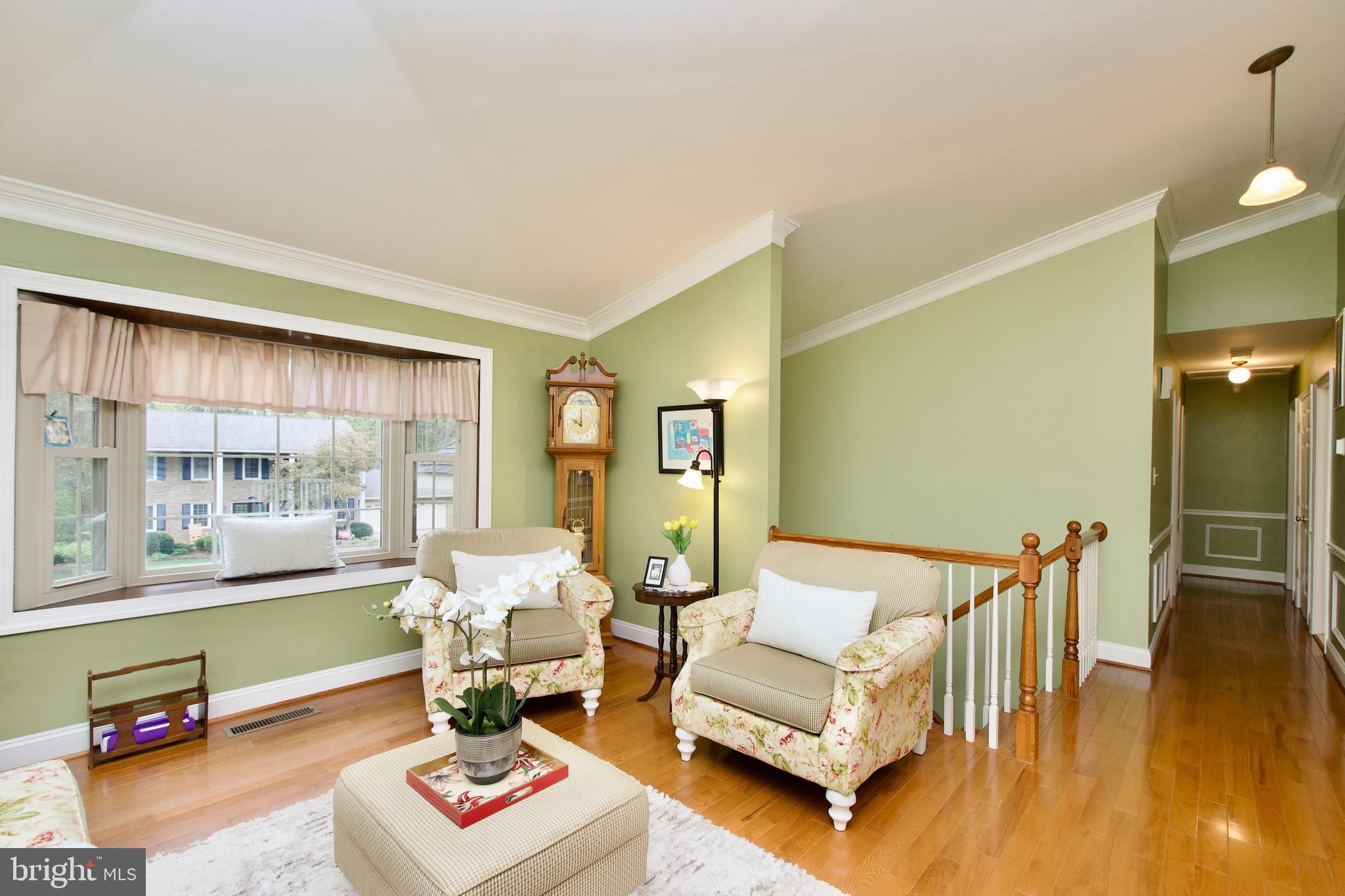 6690 Old Blacksmith Drive Burke, VA 22015 - Photo 8 of 46 a living room with furniture and a wooden floor