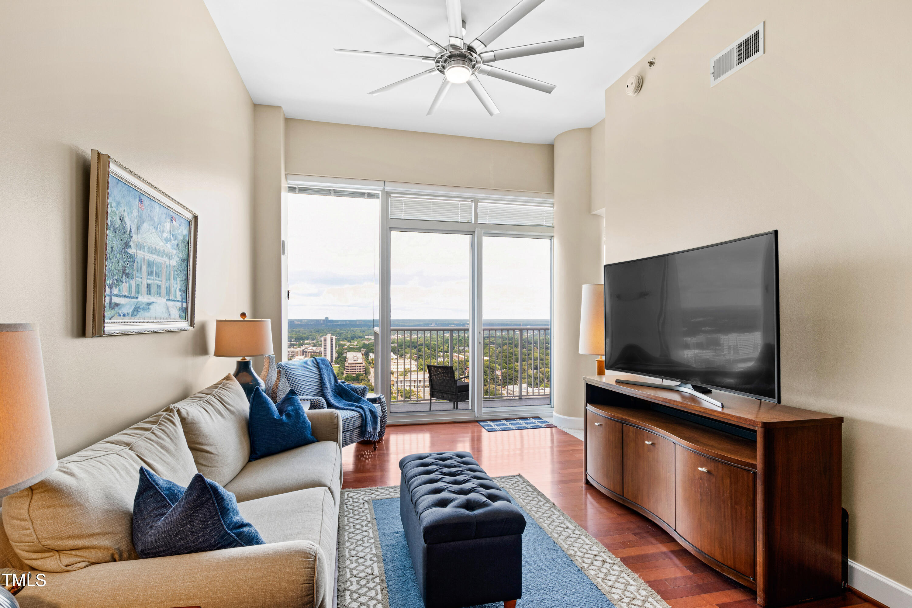 a living room with furniture and a flat screen tv