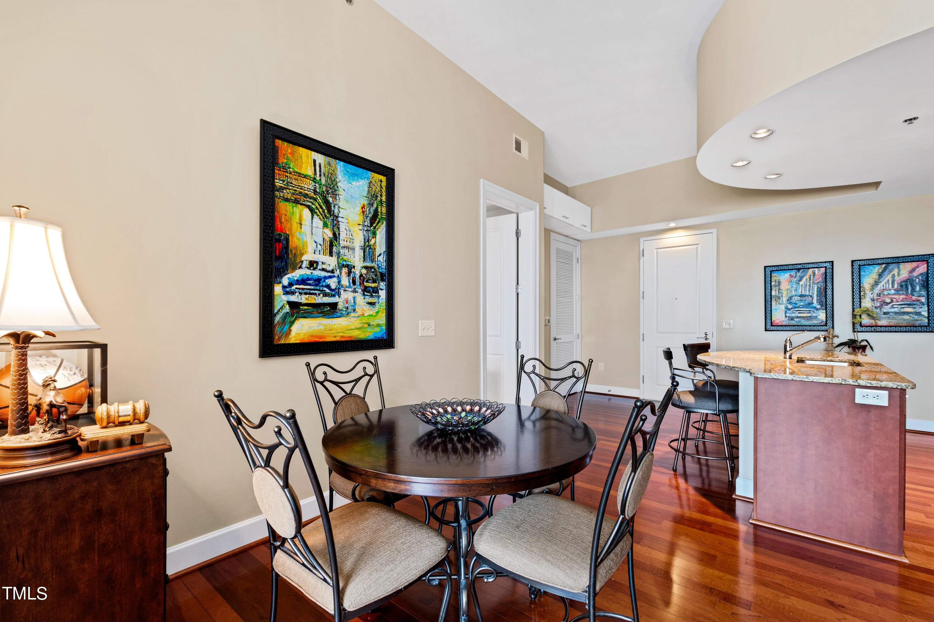 301 Fayetteville Street, Unit 3305 Raleigh, NC 27601 - Photo 20 of 80 a view of a dining room with furniture and wooden floor