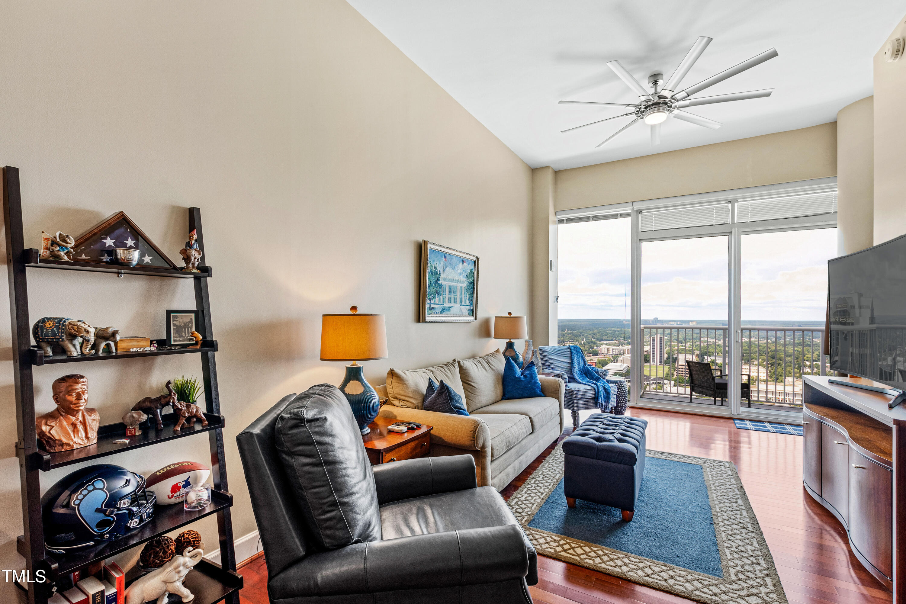 301 Fayetteville Street, Unit 3305 Raleigh, NC 27601 - Photo 22 of 80 a living room with furniture and a floor to ceiling window