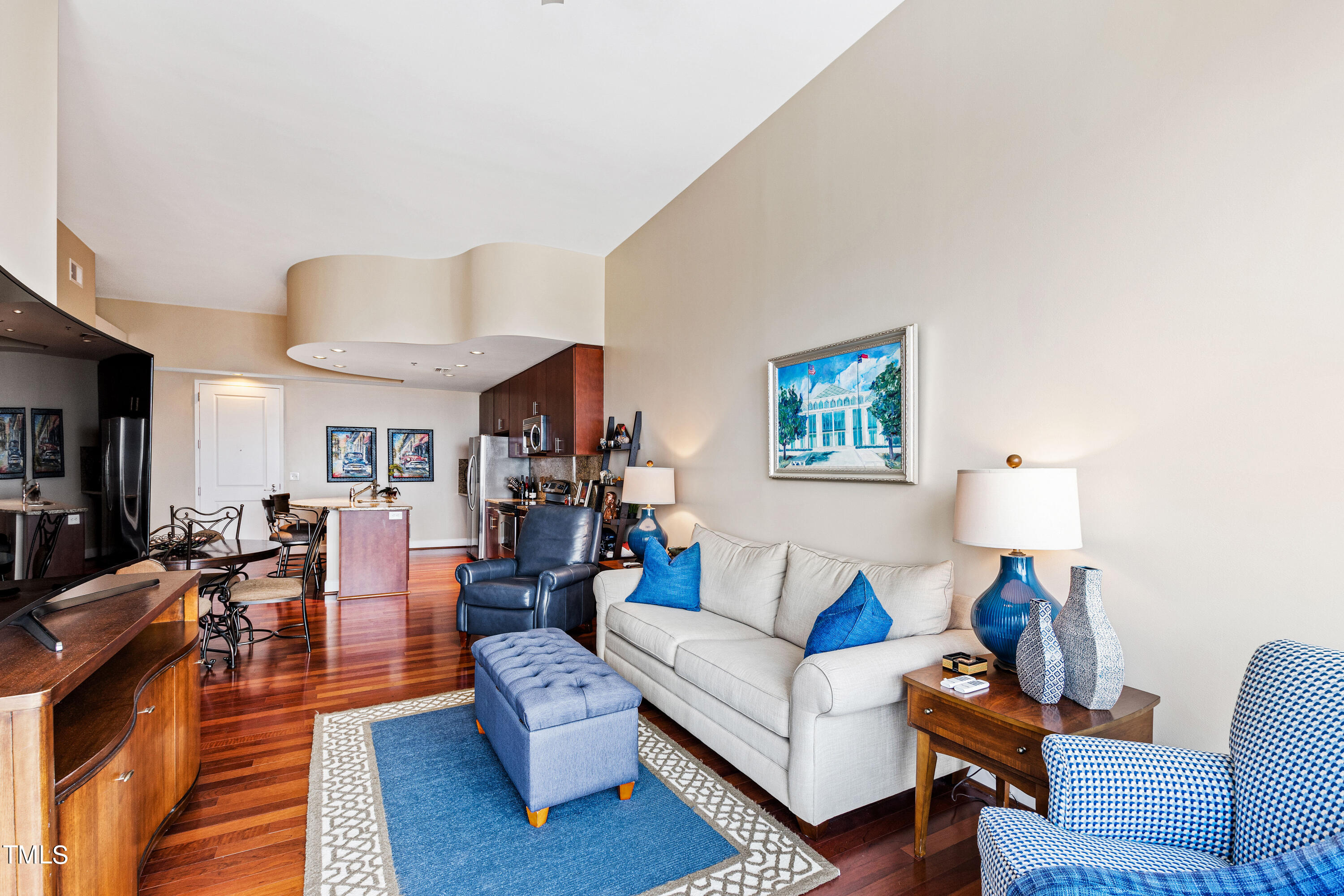 301 Fayetteville Street, Unit 3305 Raleigh, NC 27601 - Photo 23 of 80 a living room with furniture a rug and a lamp