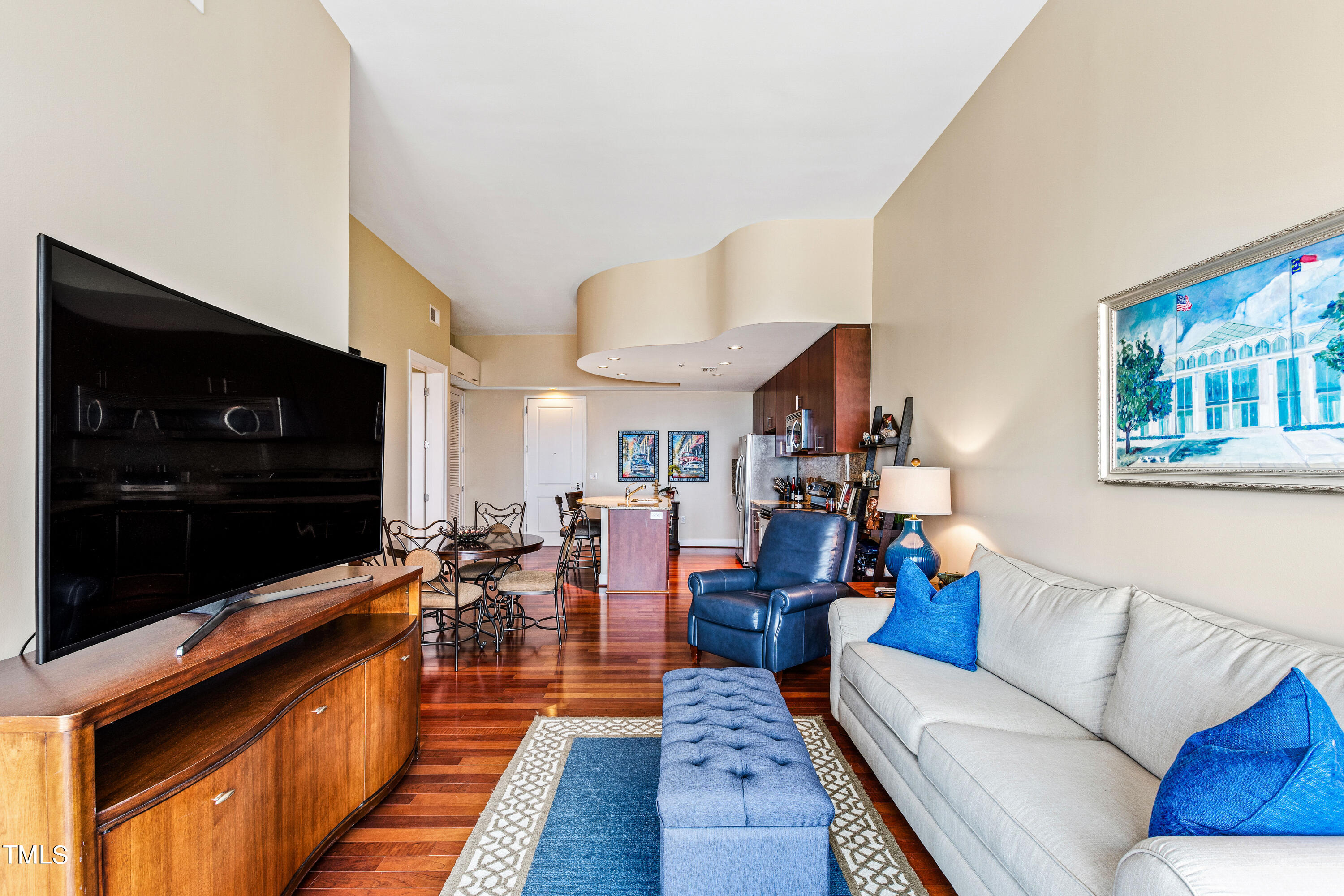 301 Fayetteville Street, Unit 3305 Raleigh, NC 27601 - Photo 24 of 80 a living room with furniture and a flat screen tv