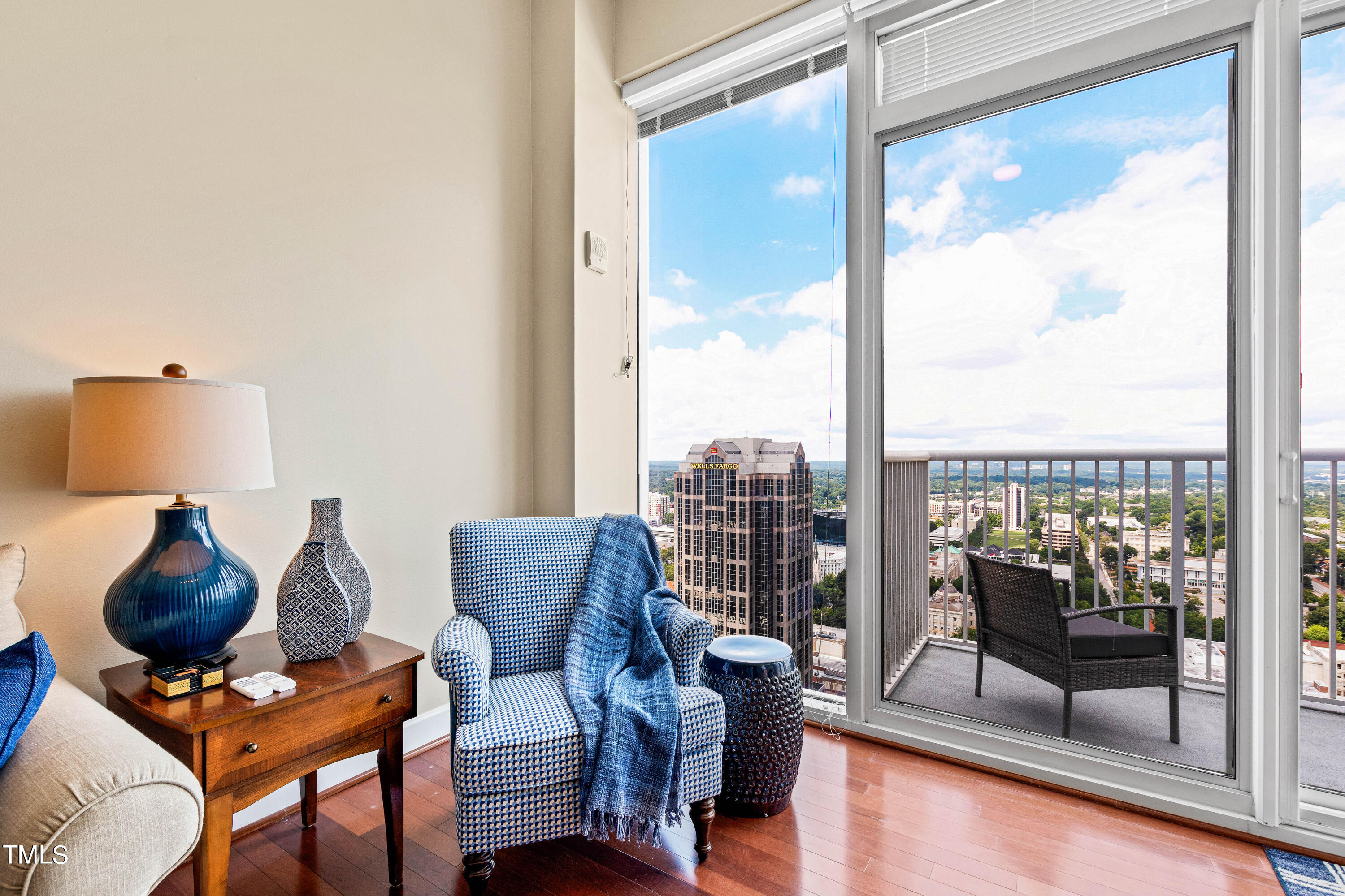 301 Fayetteville Street, Unit 3305 Raleigh, NC 27601 - Photo 25 of 80 a living room with furniture and a floor to ceiling window