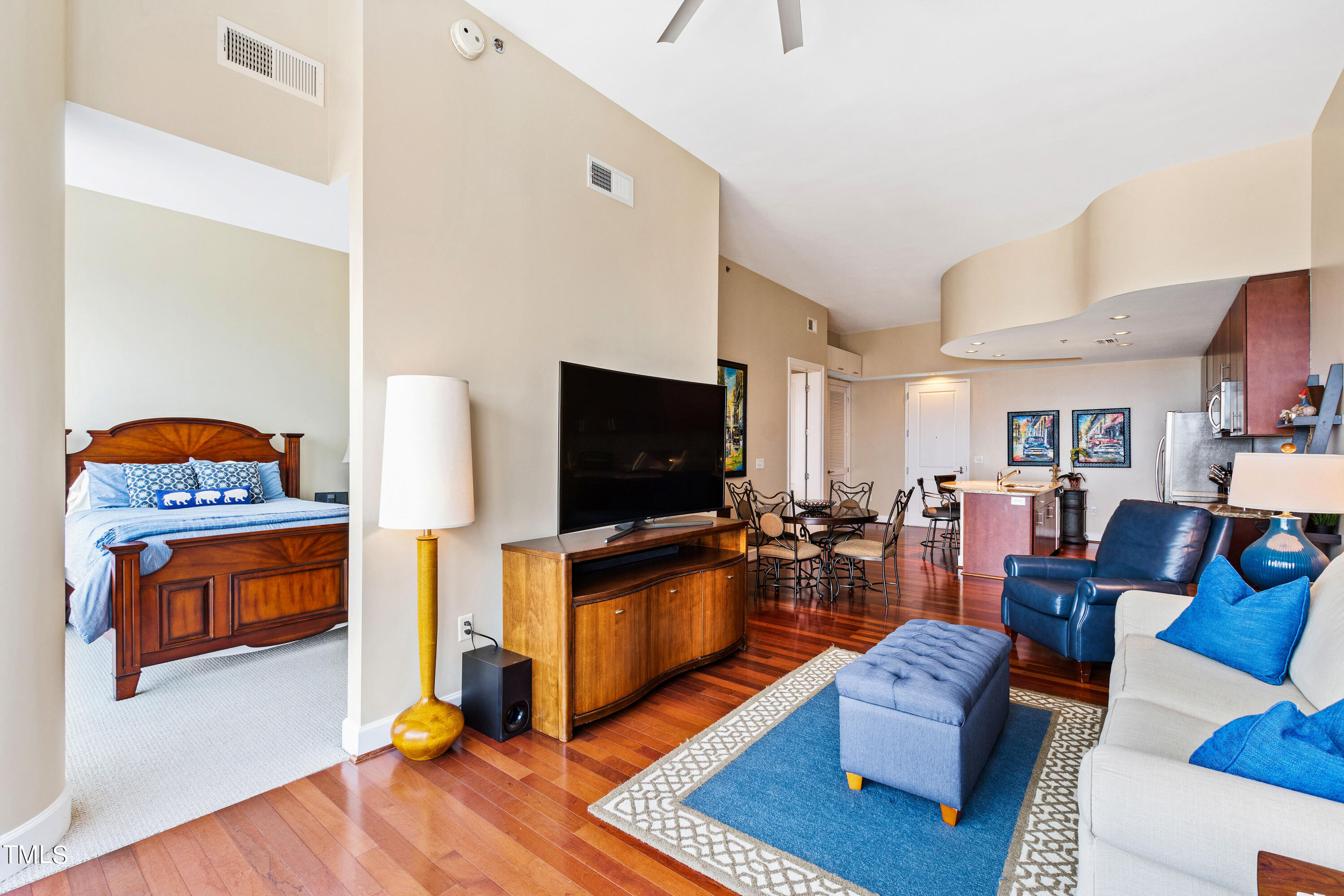 301 Fayetteville Street, Unit 3305 Raleigh, NC 27601 - Photo 28 of 80 a living room with furniture and a flat screen tv
